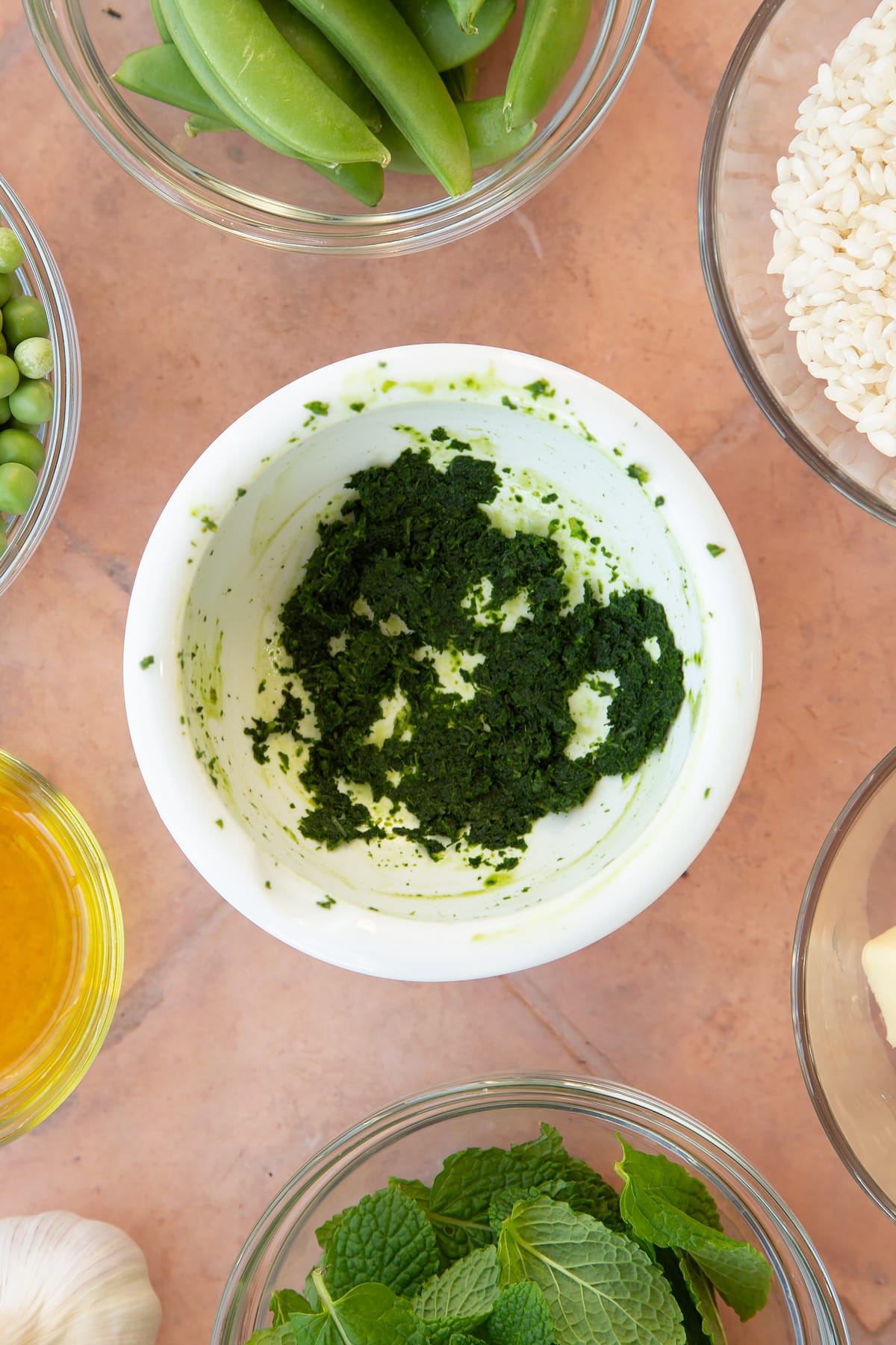 Overhead shot of the salt and mint having been combined together to create the mint paste.