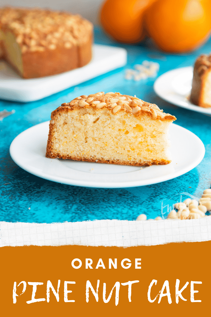 Slice of pine nut cake on a white plate. Caption reads: Orange pine nut cake.