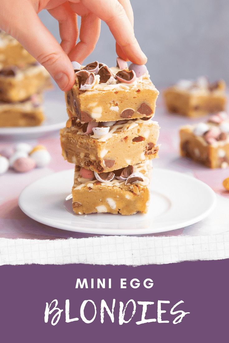 Three stacked Mini Egg blondies on a white plate. Caption reads: Mini Egg blondies