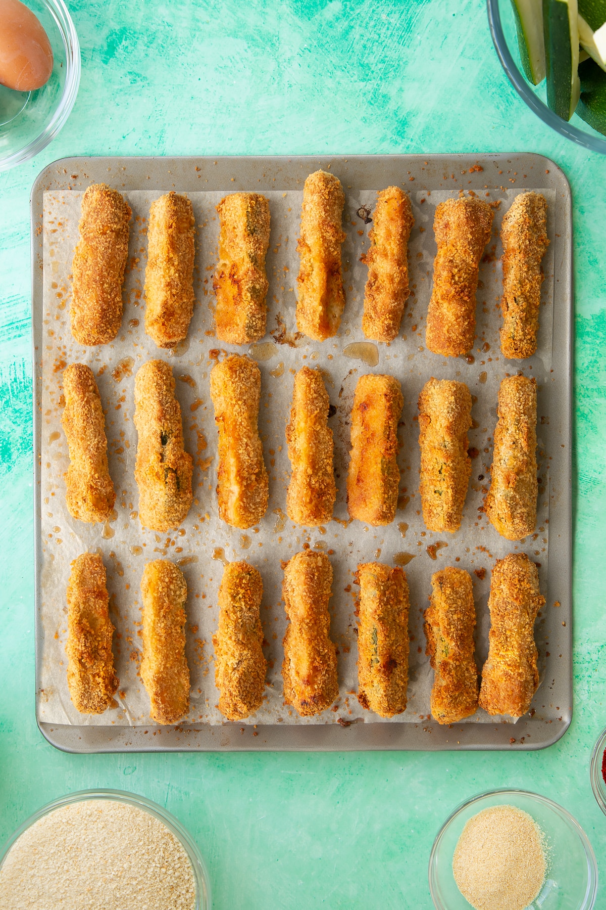 Overhead shot of the courgette fries having been baked in the oven.