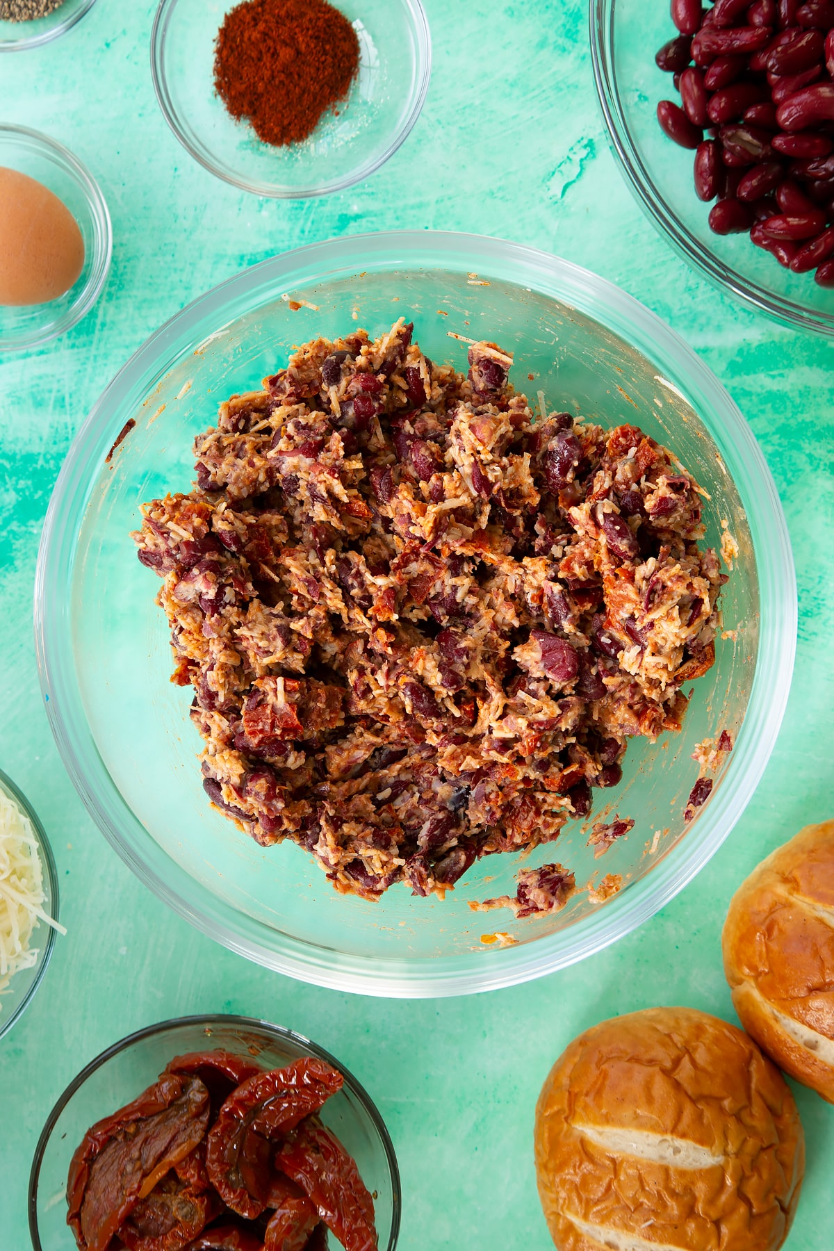 Overhead shot of the kidney bean burger ingredients mixed together in a mixing bowl.
