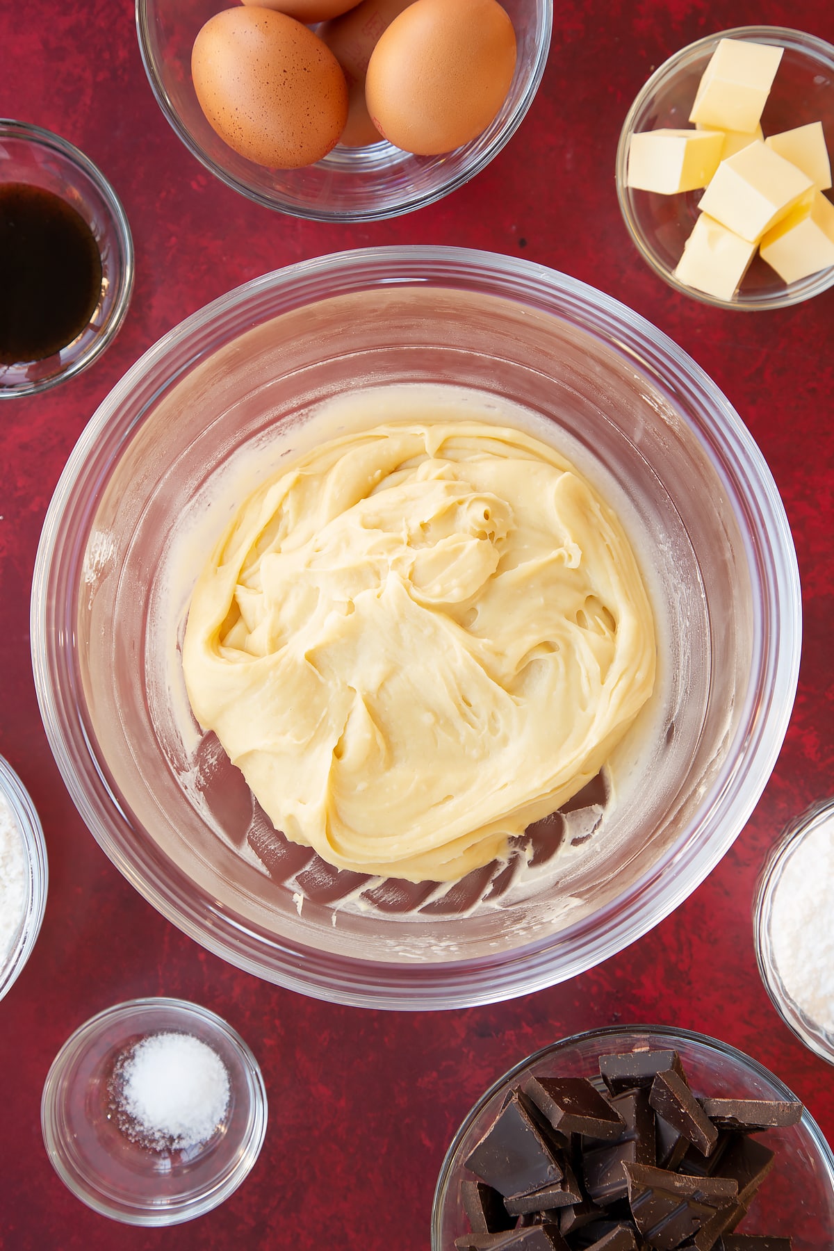 Overhead shot of the mini eclairs pastry in a large glass bowl.