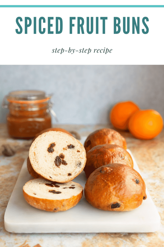 Pinterest image for the spiced fruit buns with text at the top describing the image for Pinterest.