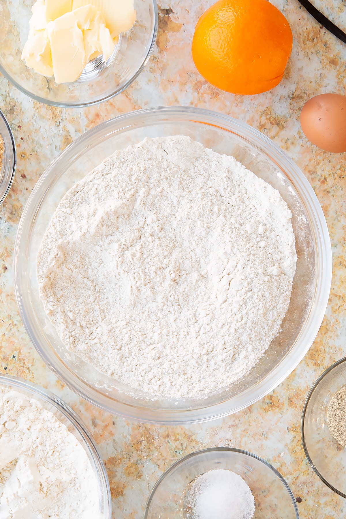 Overhead shot of some of the dry ingredients for the spiced fruit buns dough.