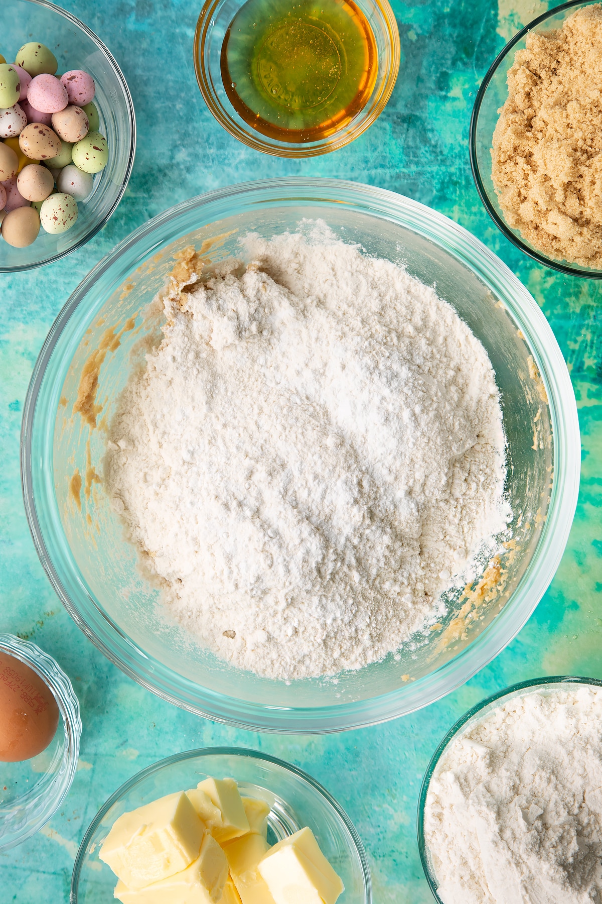 Sifting flour and baking powder into the mixing bowl.