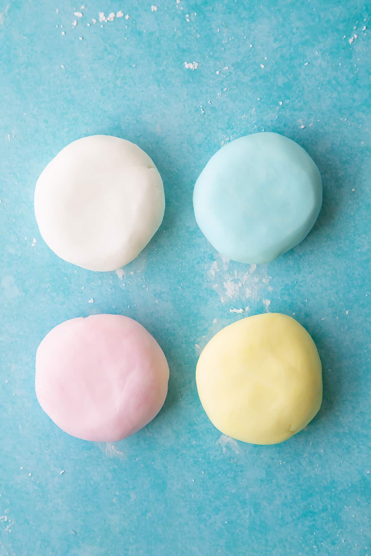 Overhead shot of the sugar paste having mixed in the food colouring.