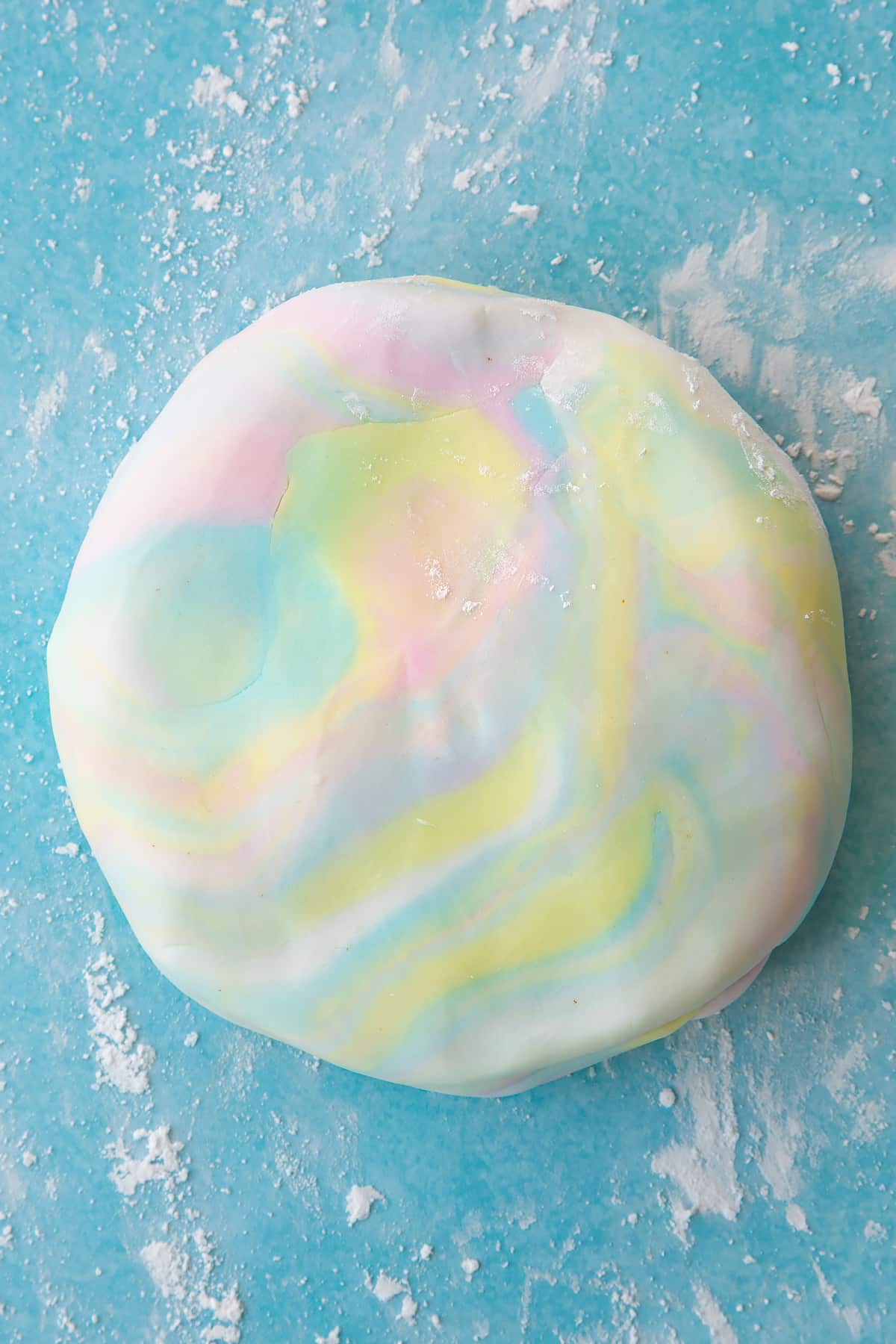 Overhead shot of the sugar paste after mixing the colours back into one and other.