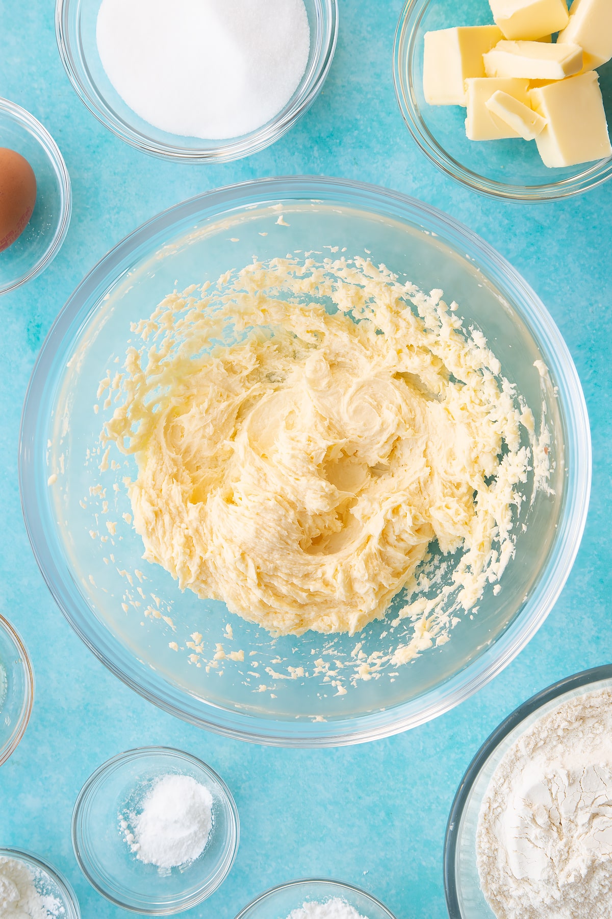 Whisking the ingredients until the mixture is soft and fluffy.