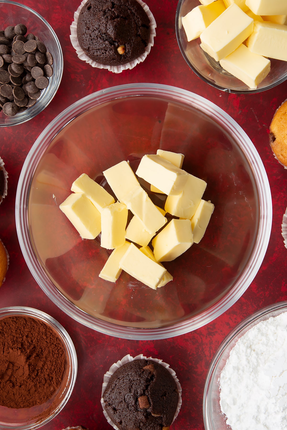Overhead shot of butter in a large glass bowl.