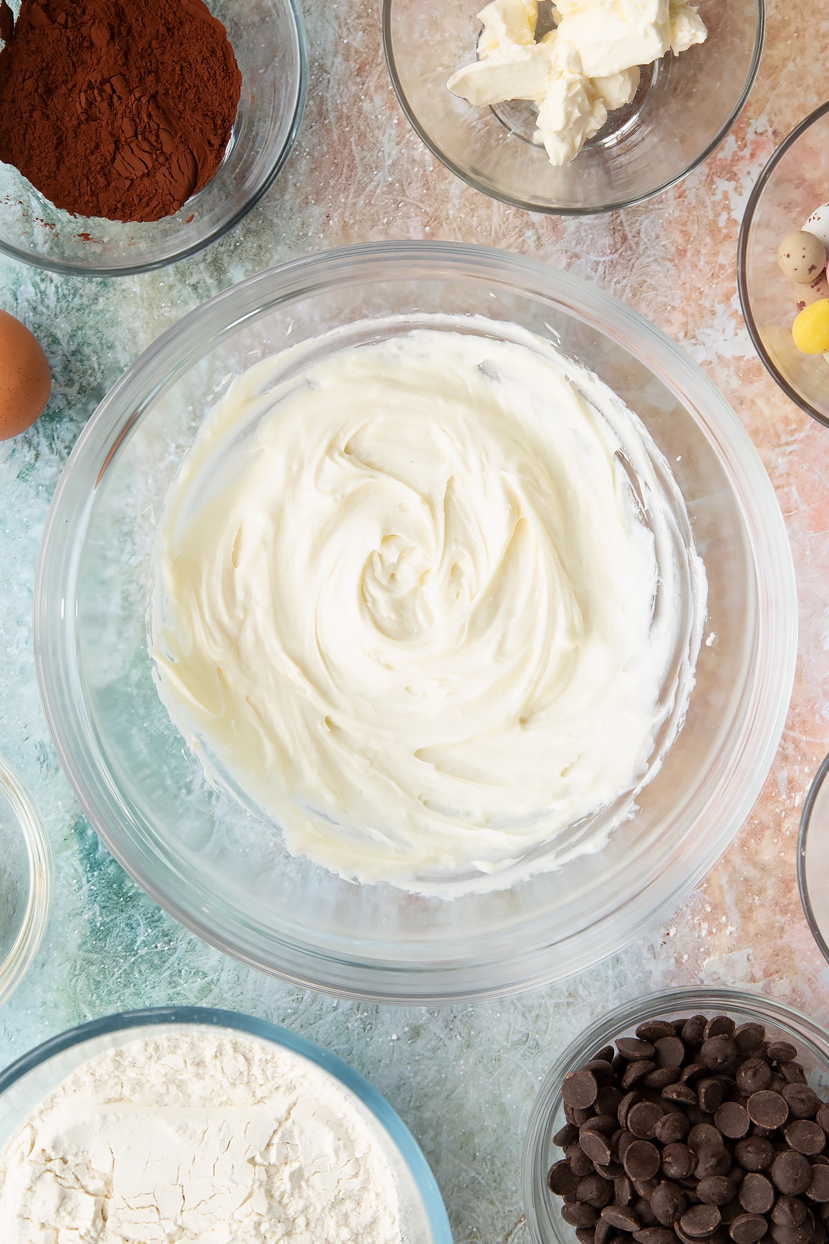 Overhead shot of a mixing bowl after the white chocolate and cream cheese has been whisked together.