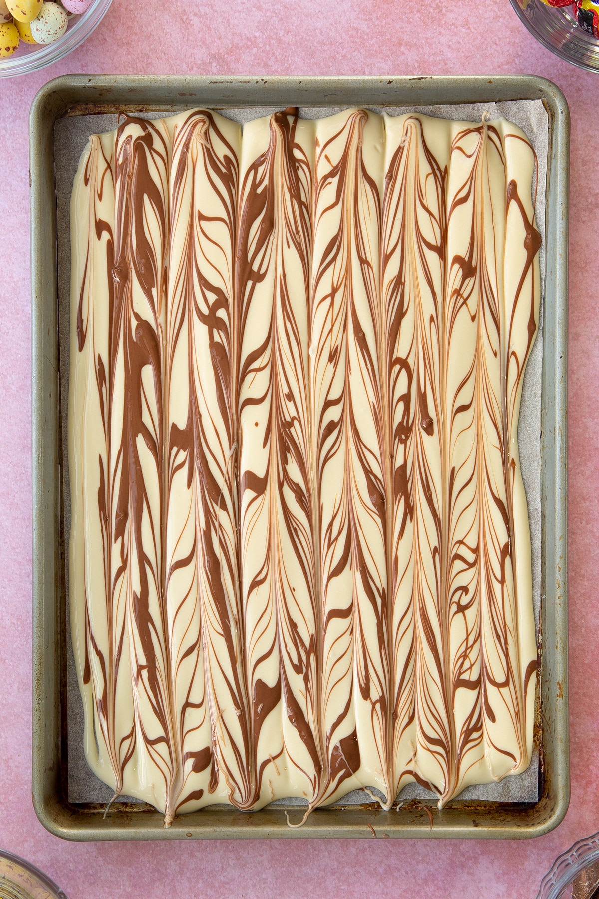 Overhead shot of the white chocolate after the milk chocolate has been swirled into the melted white chocolate base layer.