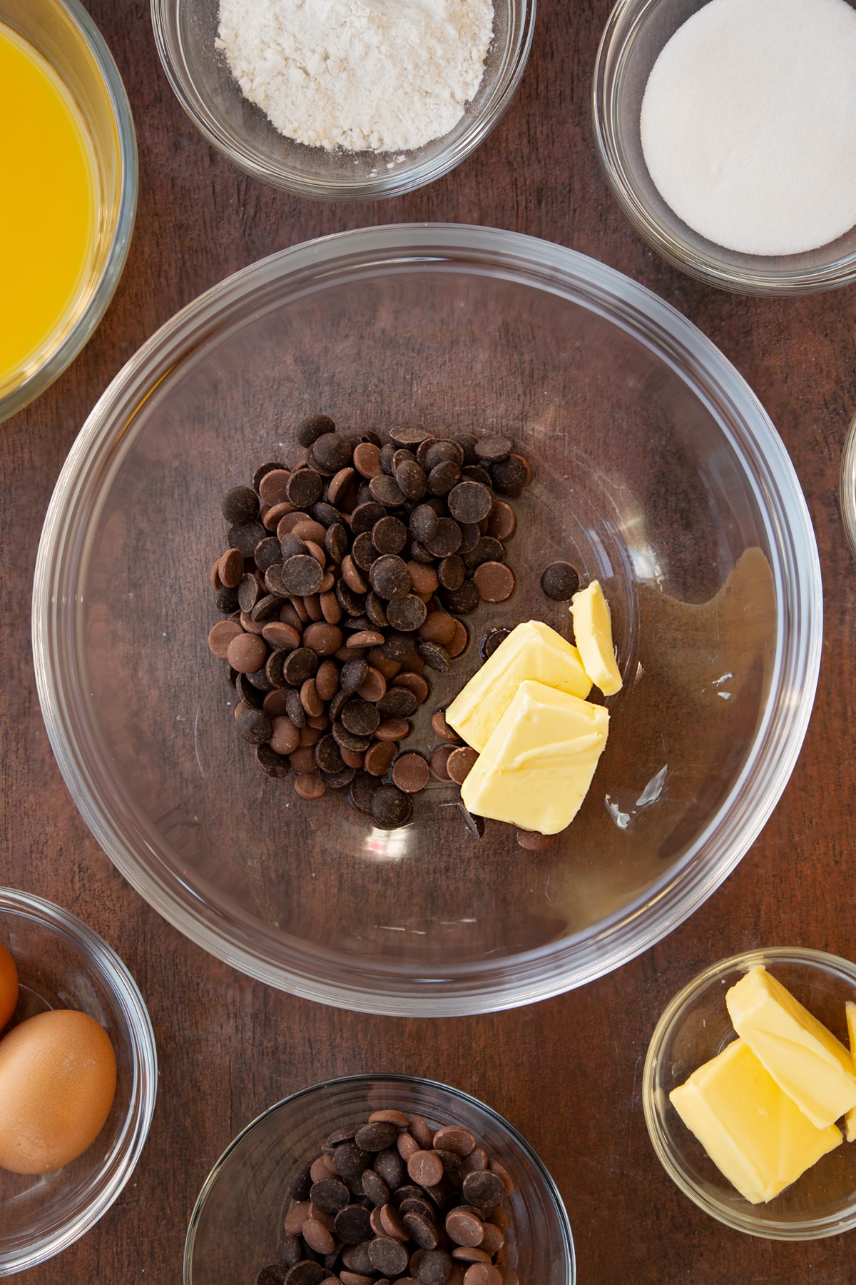 Dark chocolate, milk chocolates, butter and 2 tbsp water in a bowl.