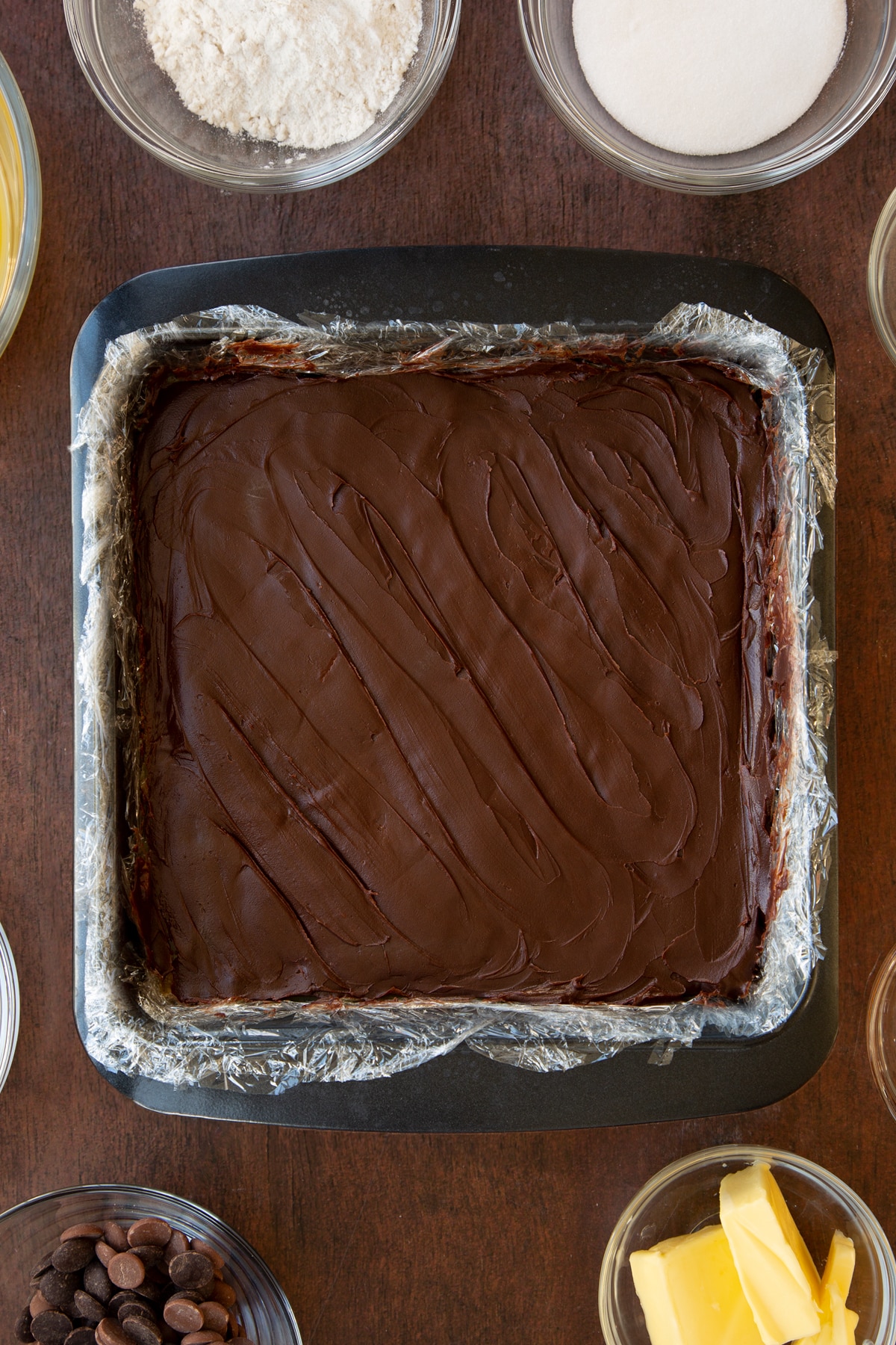 Overhead shot of the baking tray having had chocolate smoothed out ontop.