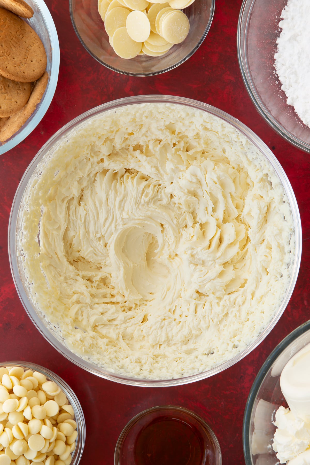 whisked double cream and icing sugar mix in a large clear bowl.