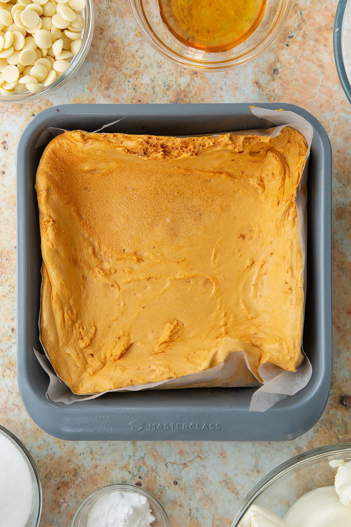 set honeycomb mixture in a square cake tin lined with parchment paper.