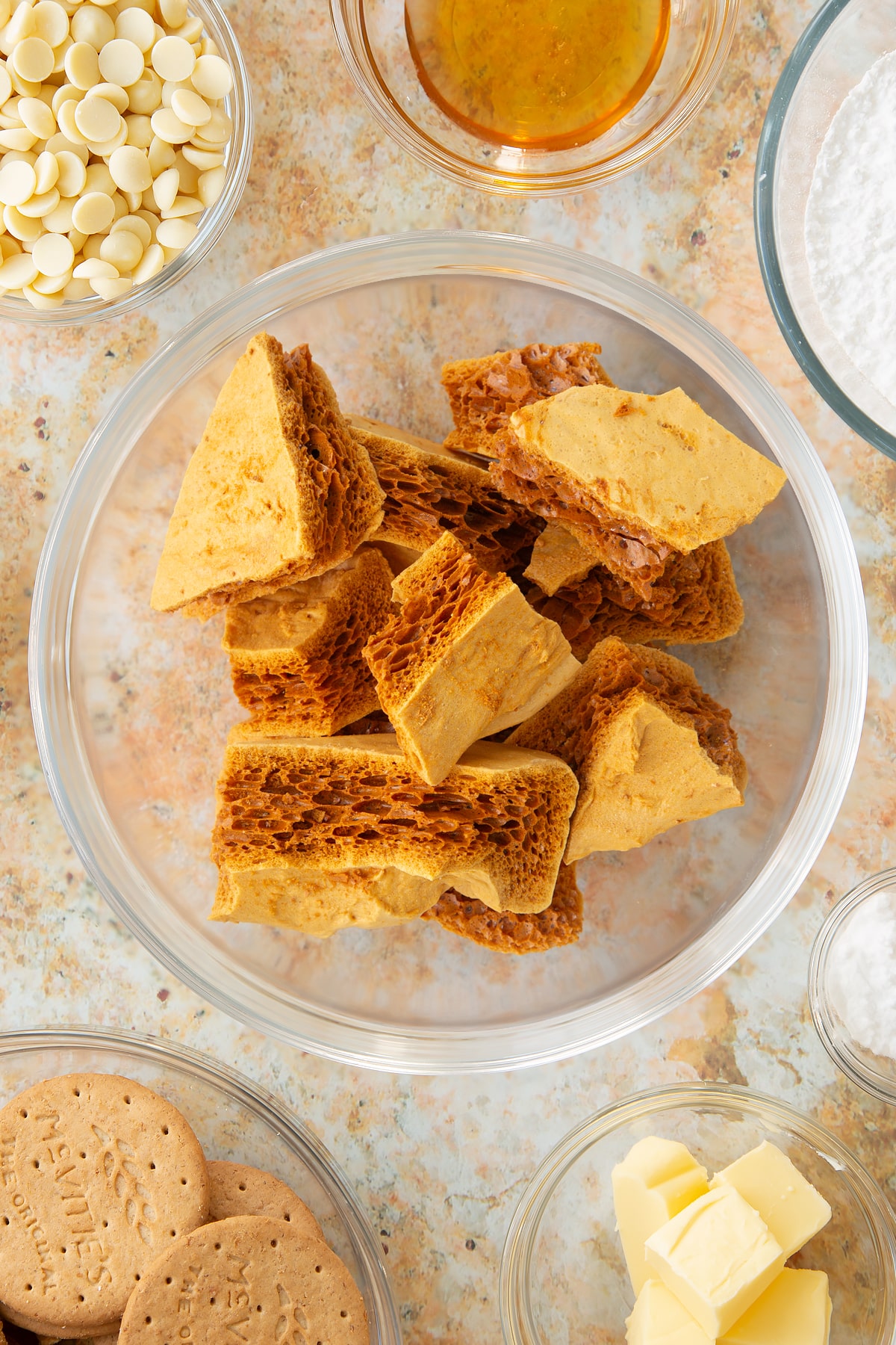 broken honeycomb pieces in a large clear bowl.