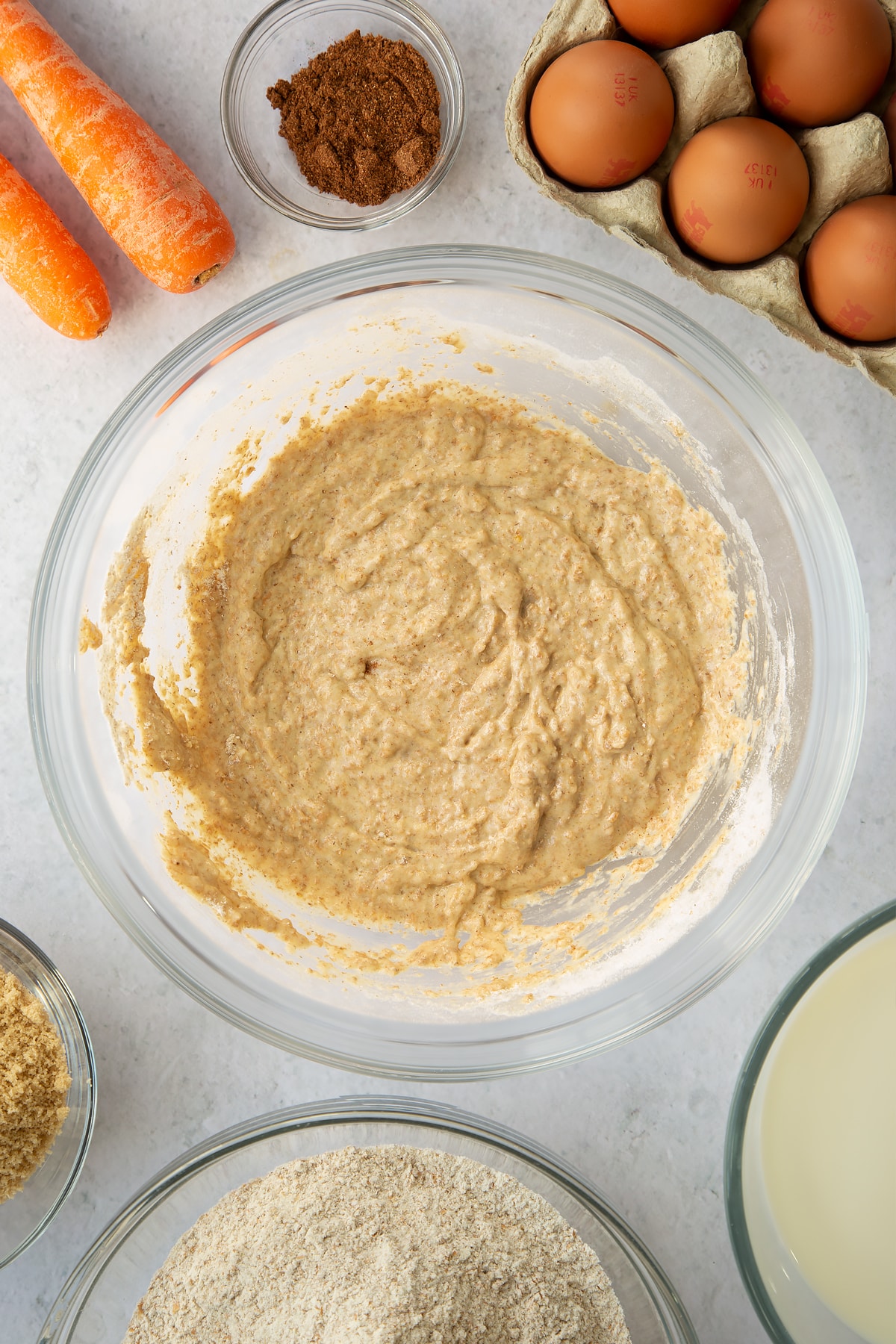 whisked egg, sugar and flour mixture in a large clear bowl.