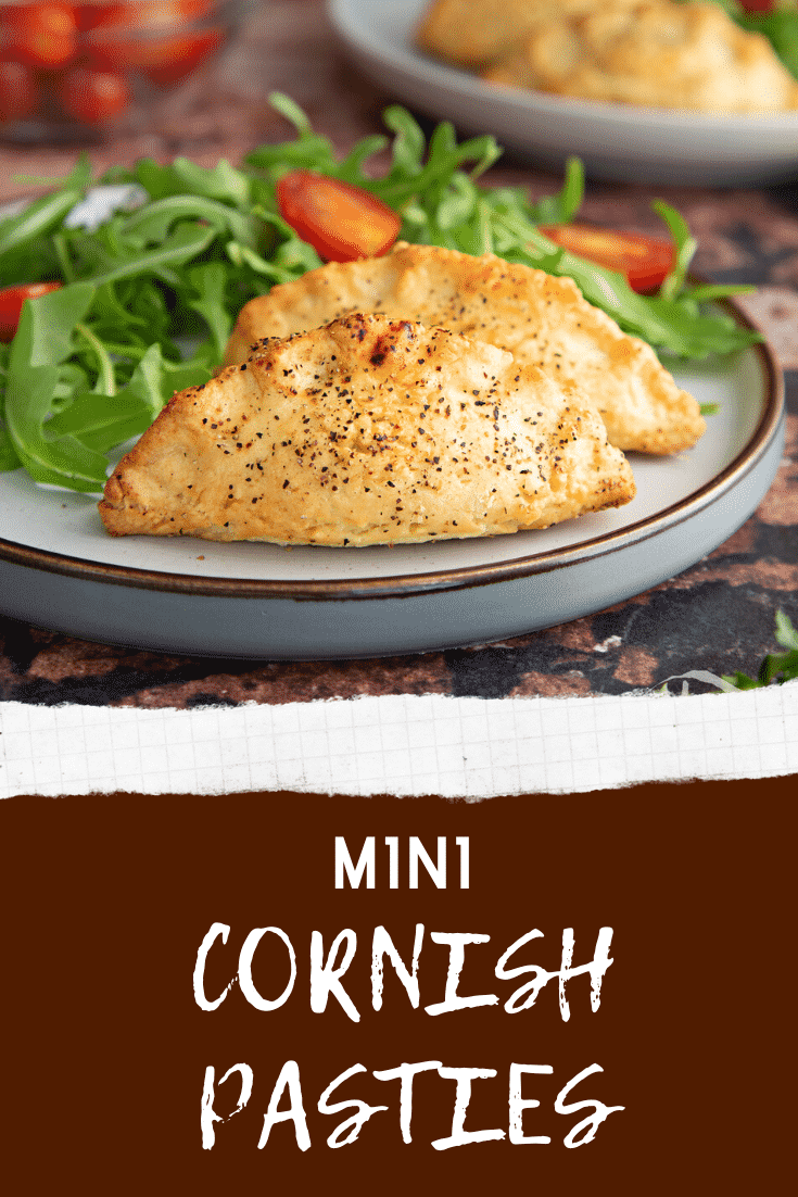 Pinterest image for the mini cornish pasties. The image is of the mini cornish pasties on a decorative plate served with a side salad and at the bottom is some text describing the image.