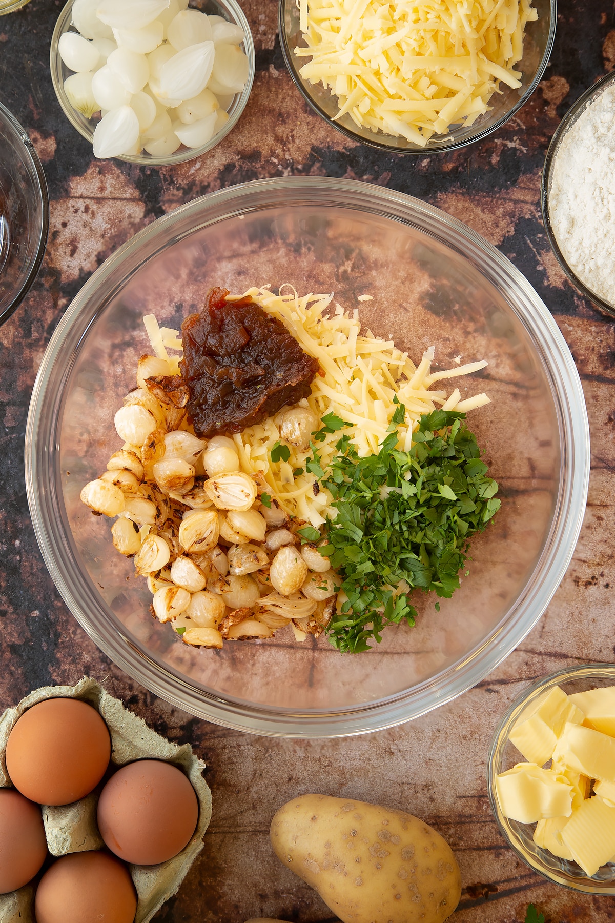 Overhead shot of some of the ingredients required for the mini cornish pasties in a pan.