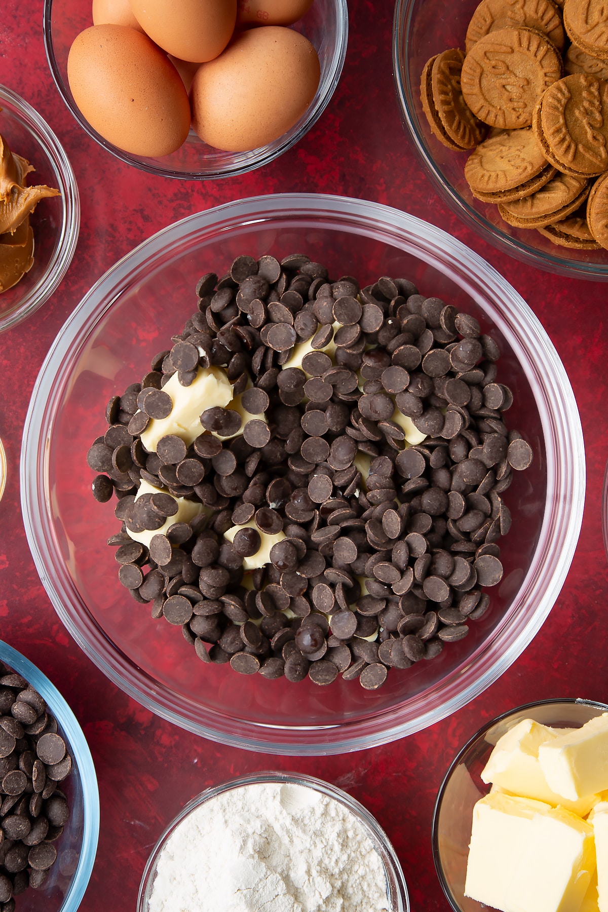 butter and dark chocolate in a large clear bowl.