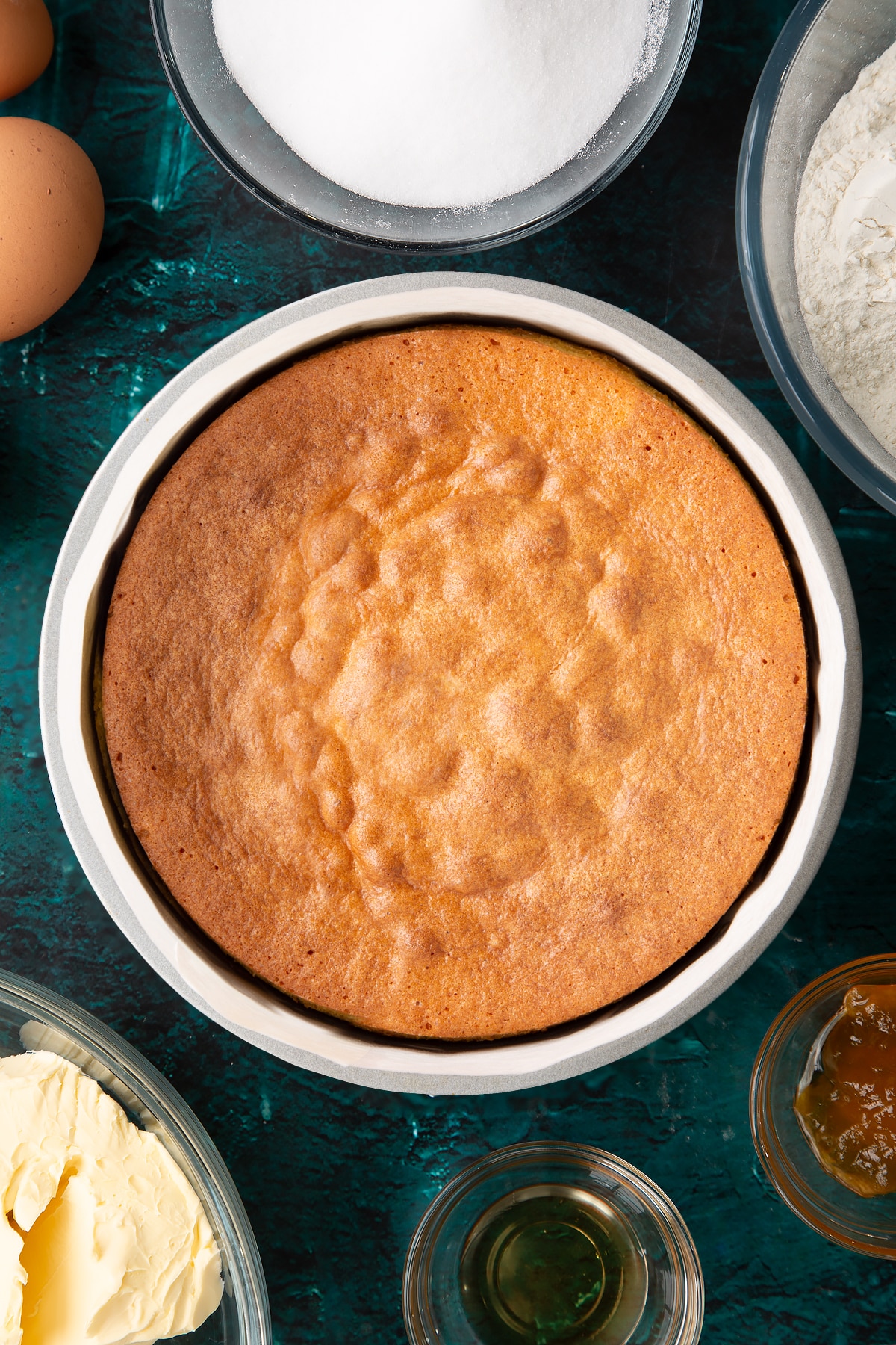 cooked vanilla cake in a lined cake tin.