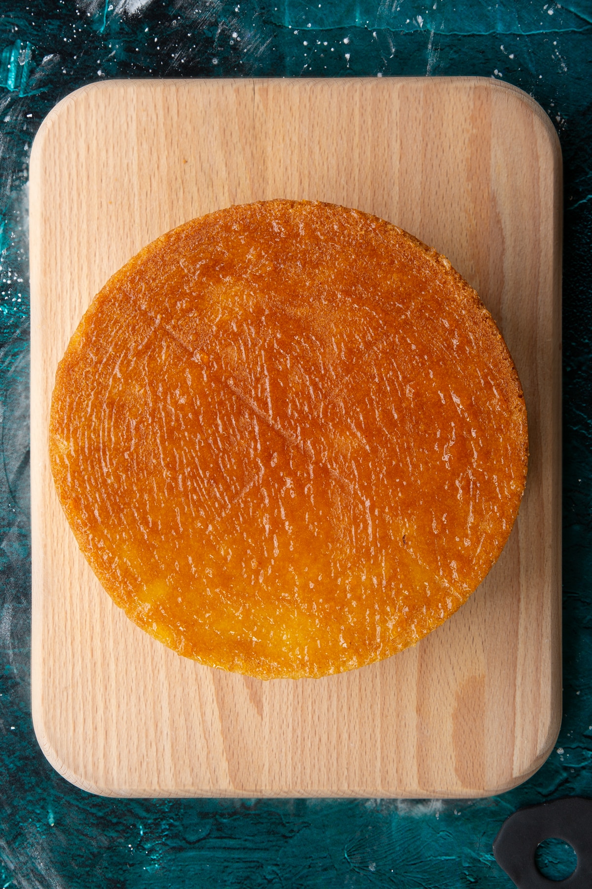 baked vanilla cake upside down coated in apricot jam.