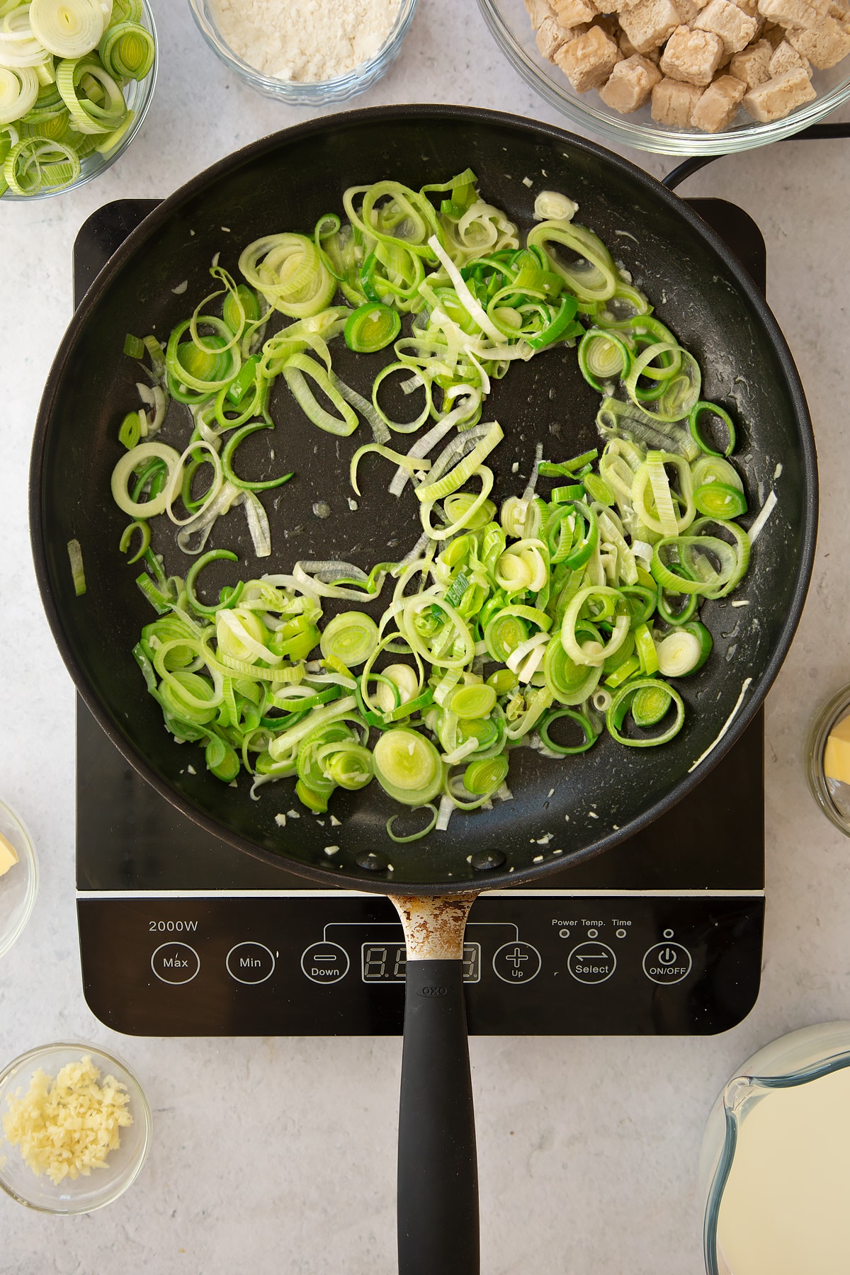 cooked sliced leeks and garlic in a large frying pan.