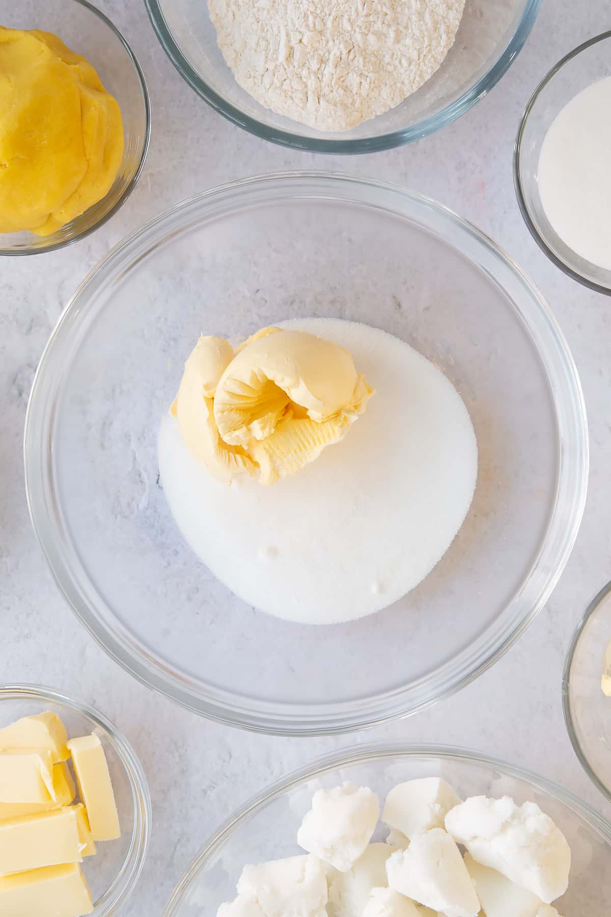 Butter and sugar in a mixing bowl.