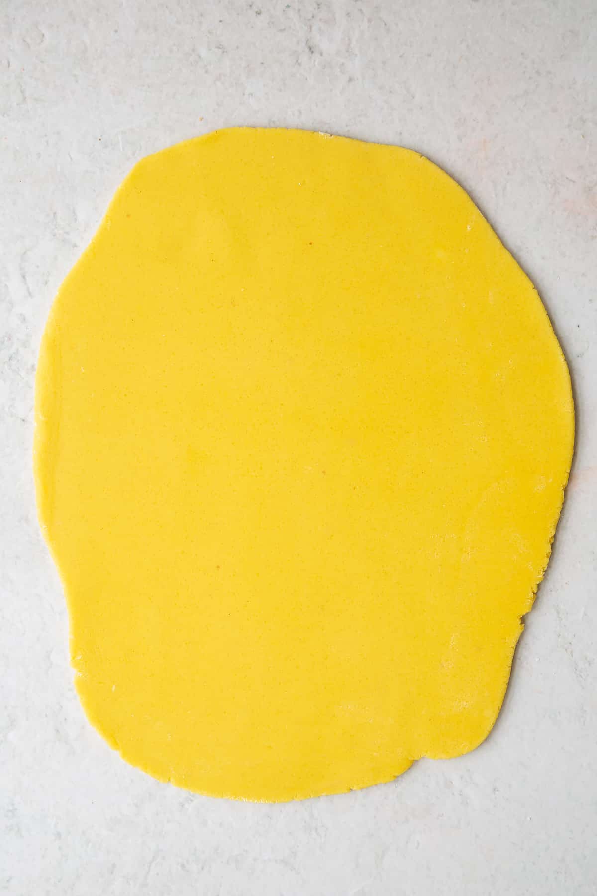 Marzipan rolled out on a board.