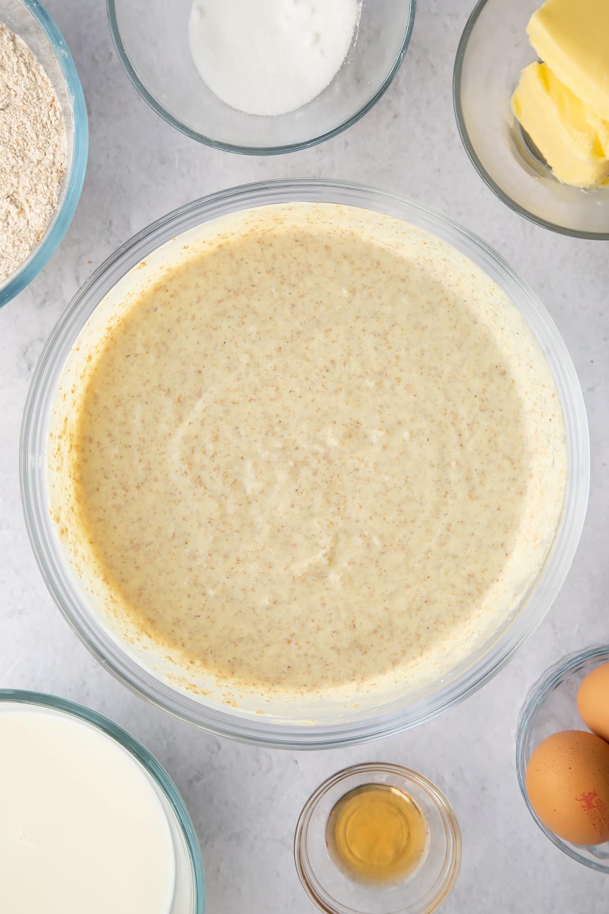 whisked wholemeal flour and egg mixture in a large clear bowl.