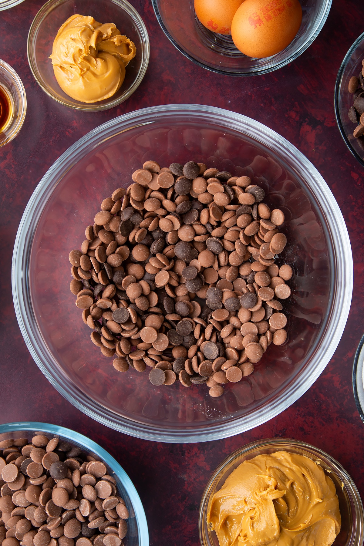 milk and dark chocolate chips in a large clear bowl.