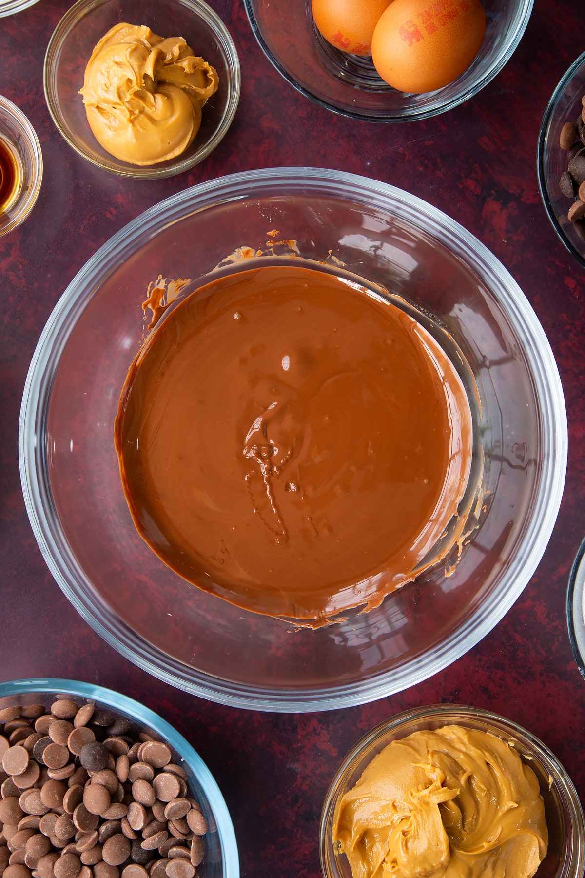 melted milk and dark chocolate chips in a large clear bowl.