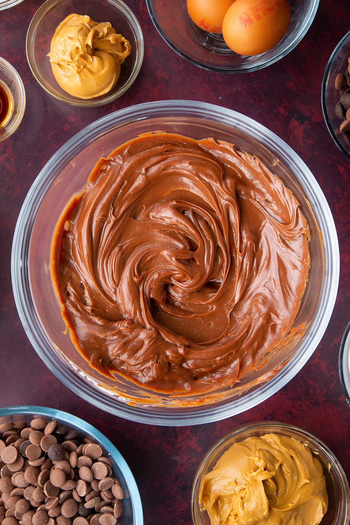 peanut butter chocolate ganache in a large clear bowl.