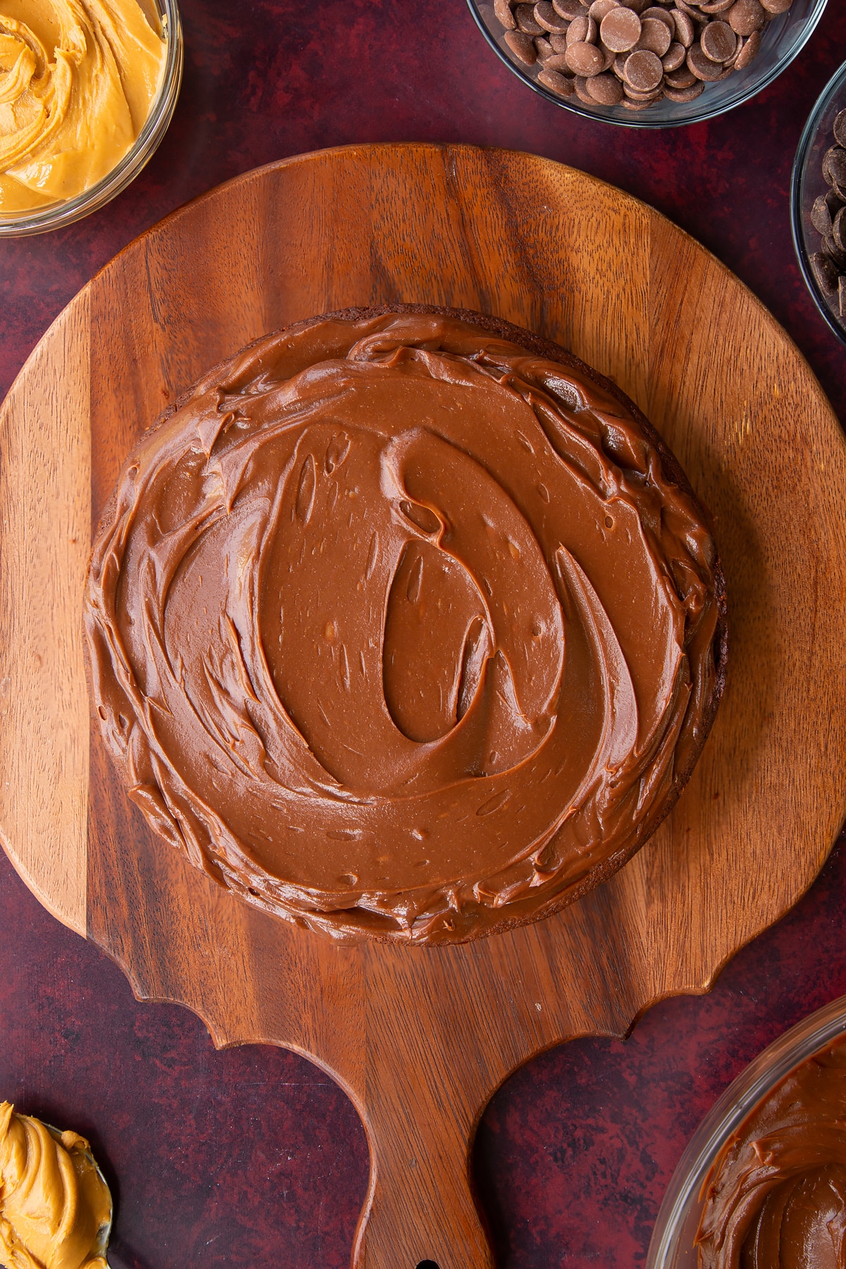 a chocolate cake topped with chocolate peanut butter ganache.