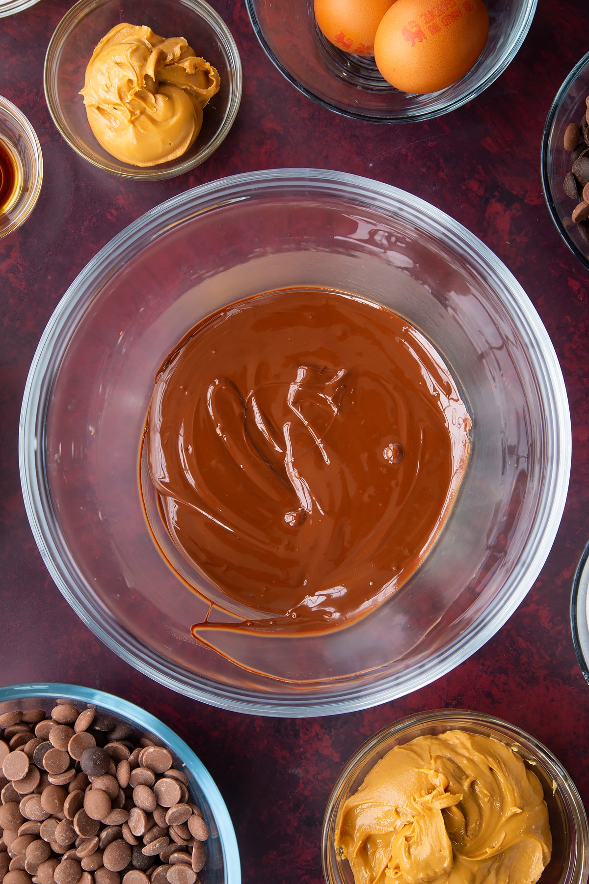melted milk and dark chocolate chips in a large clear bowl.