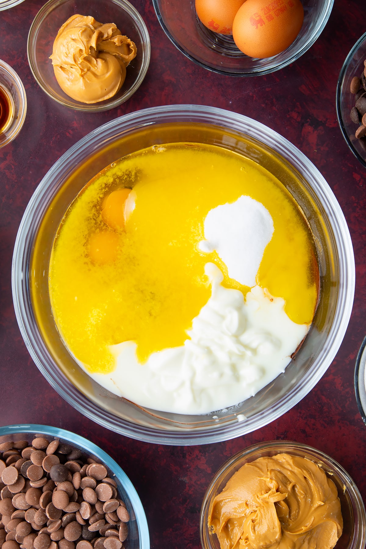 eggs, buttermilk, vanilla, butter and sugar in a large clear bowl.