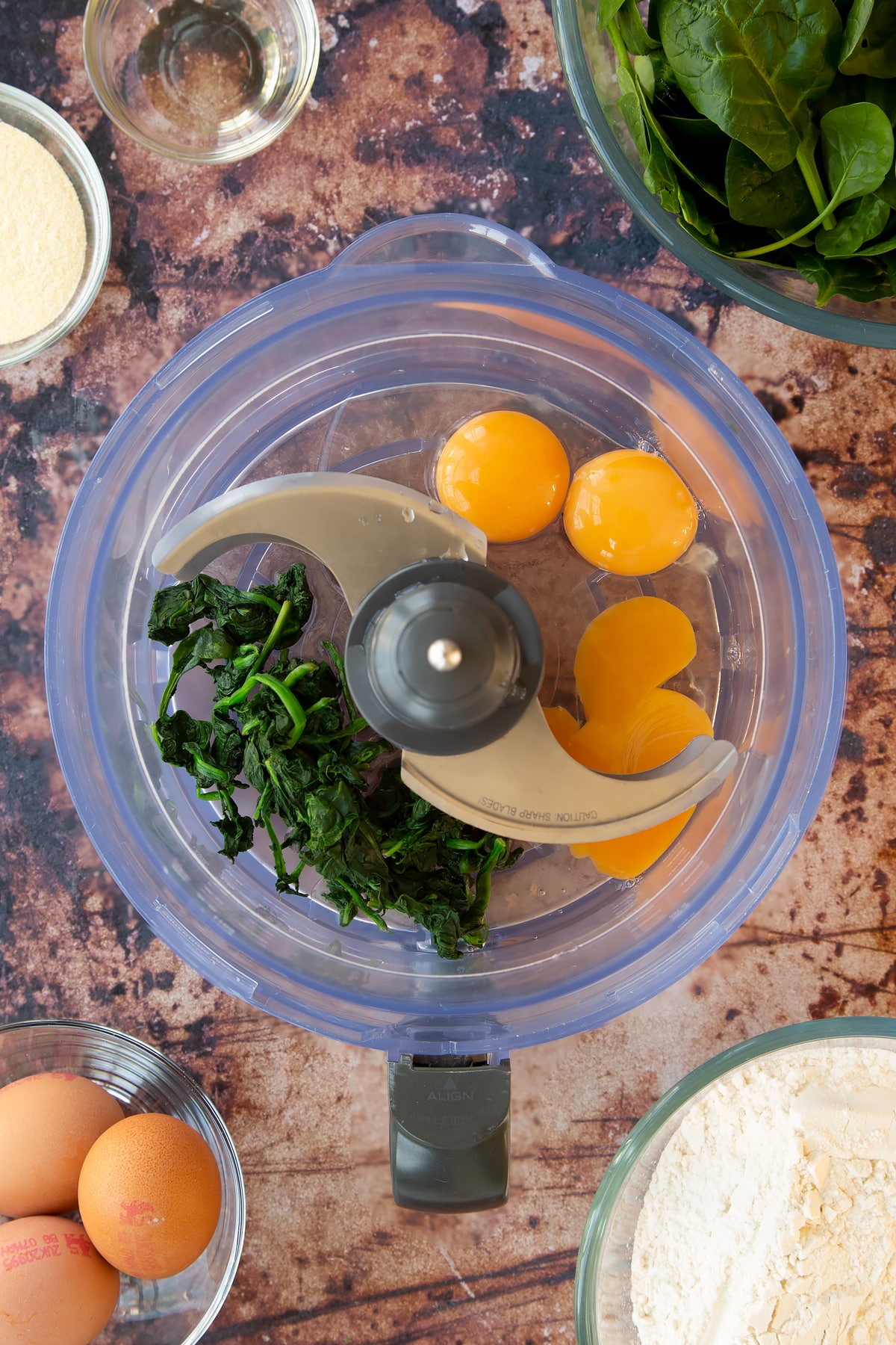 wilted spinach and eggs in a food processor.