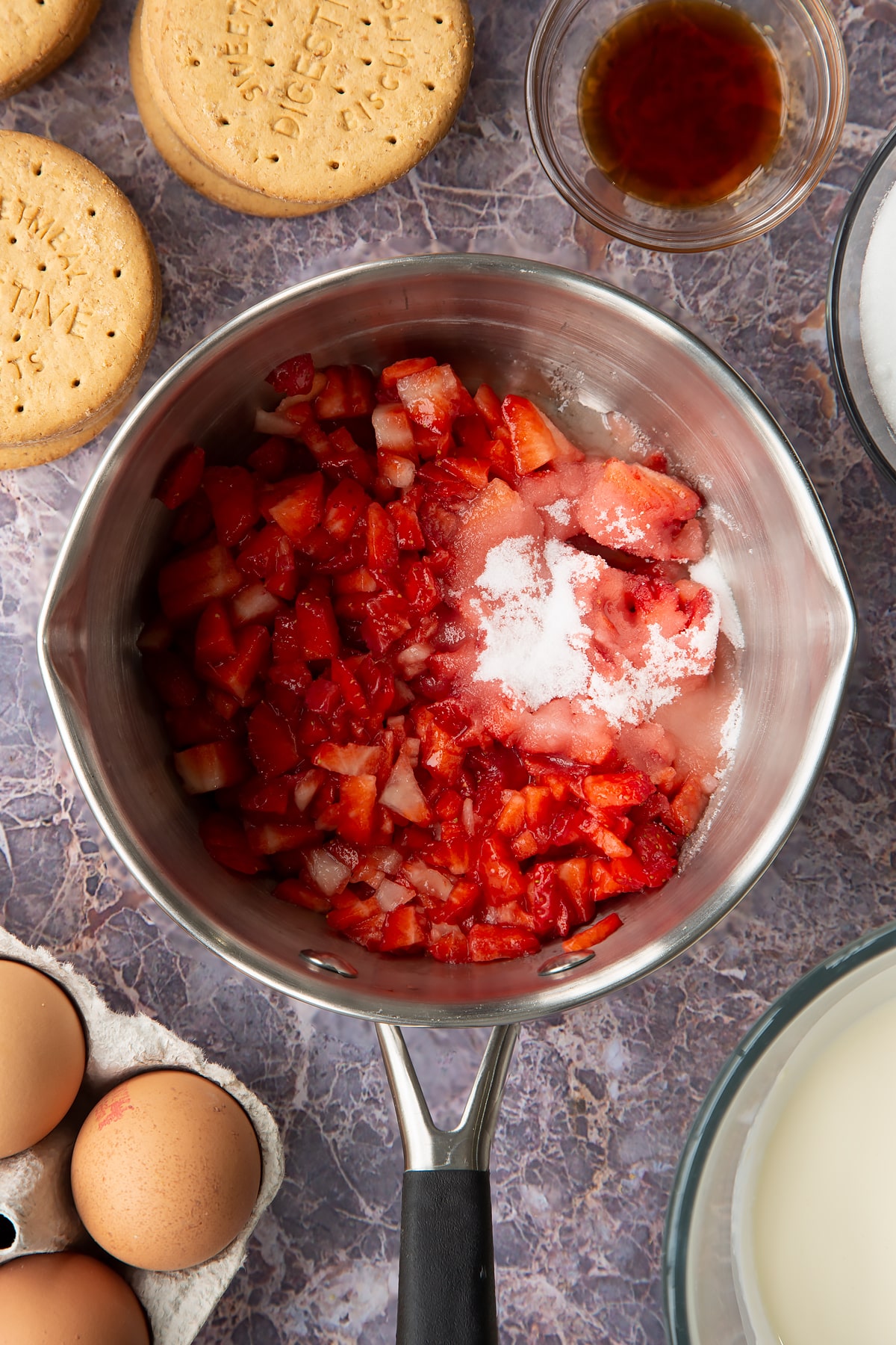 chooped strawberries in a pan with the sugar and lemon juice.