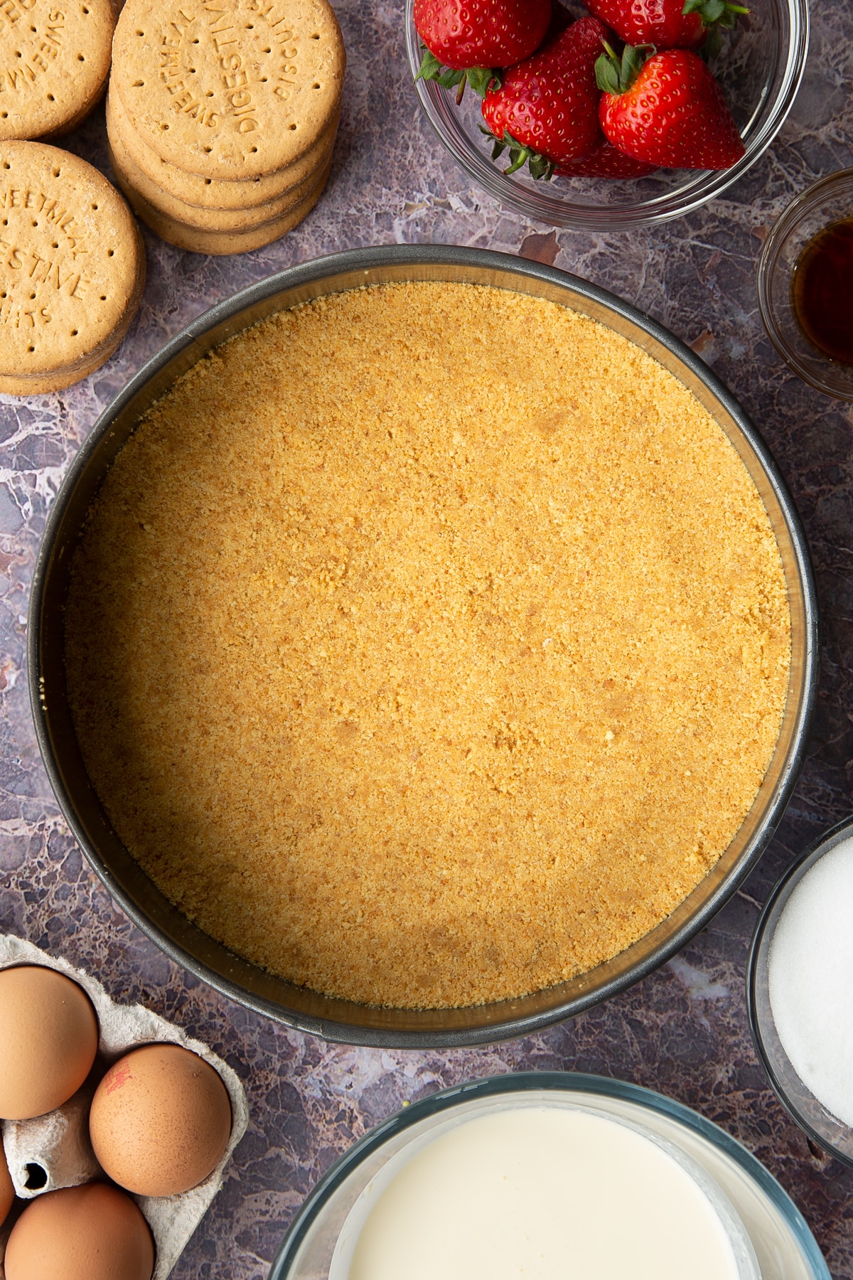 baked buttery digestive crumb base in a large springform cake tin.
