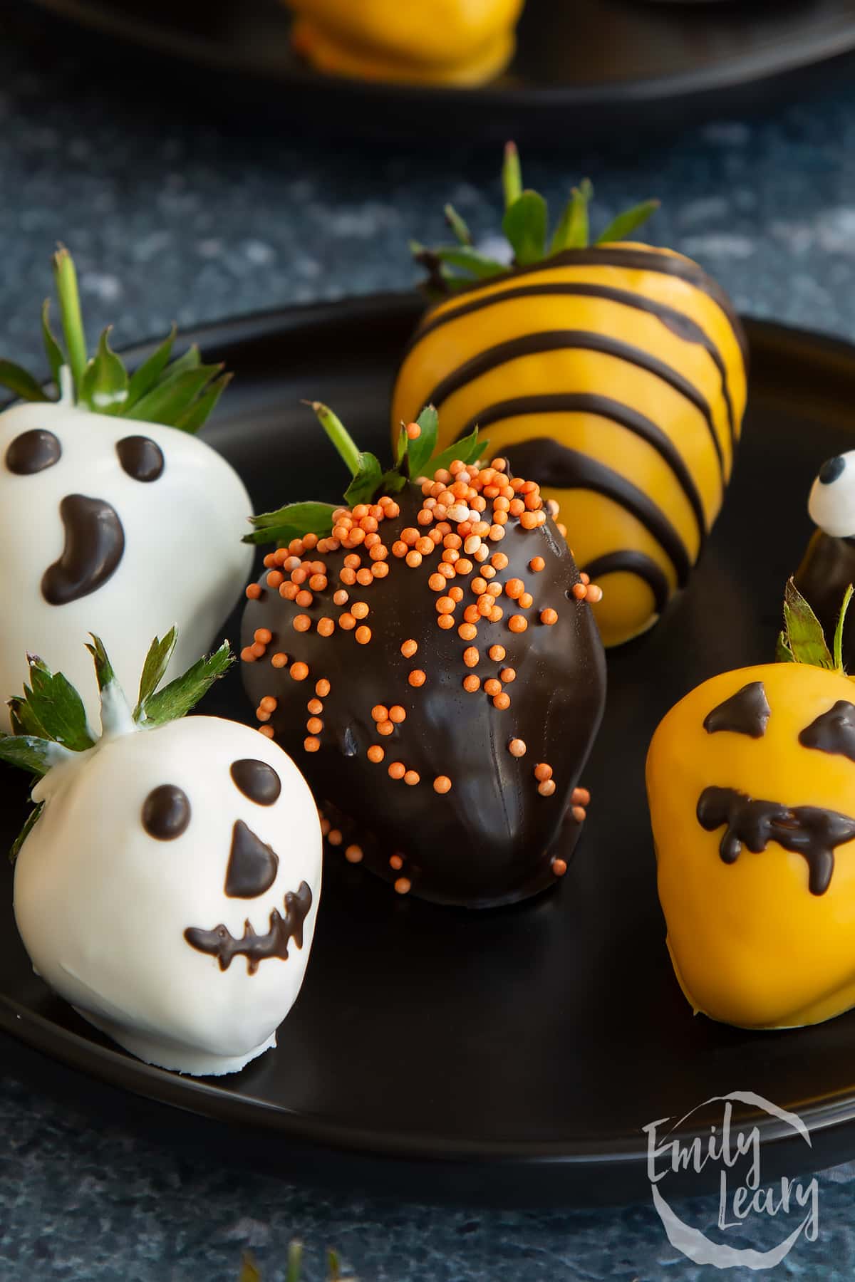 Close up shot of the finished halloween chocolate covered strawberries.