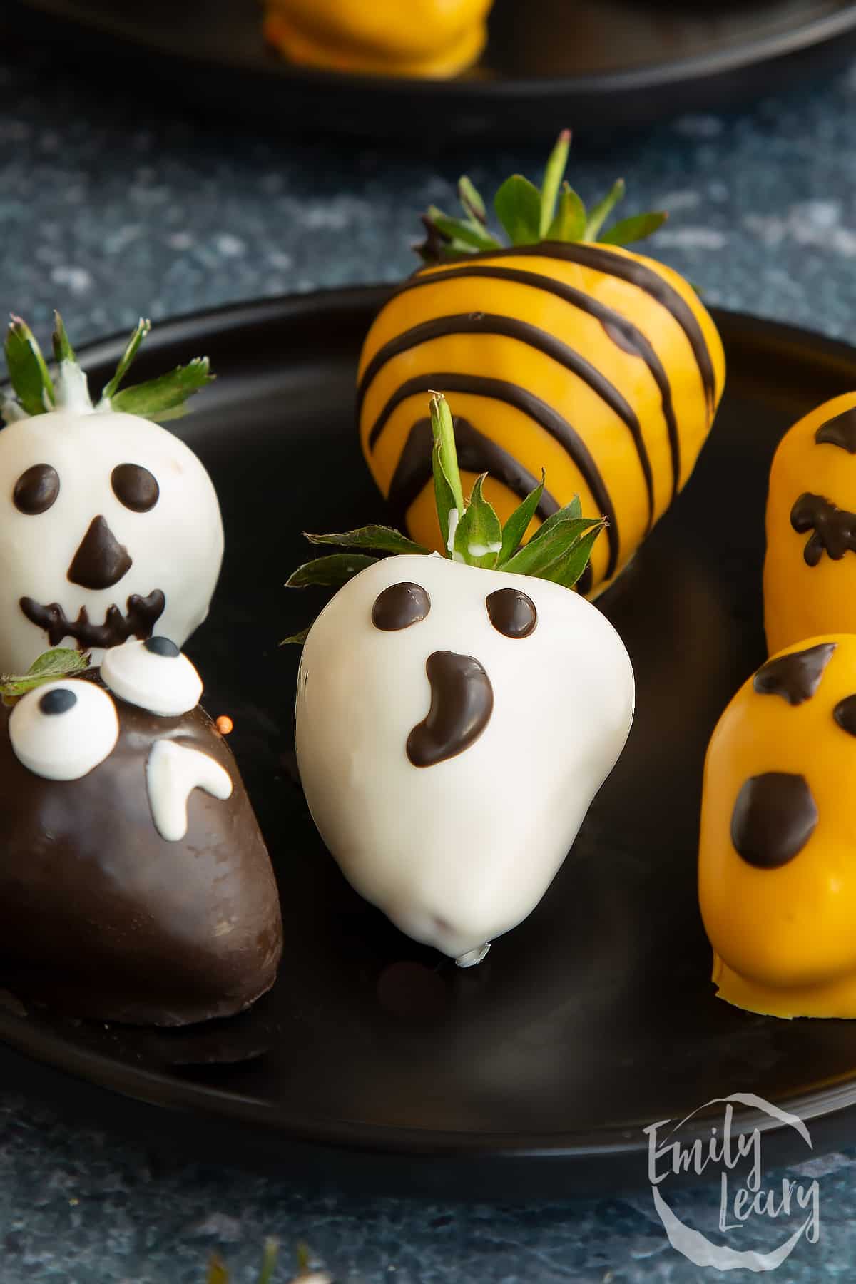 Close up shot of the finished halloween chocolate covered strawberries.