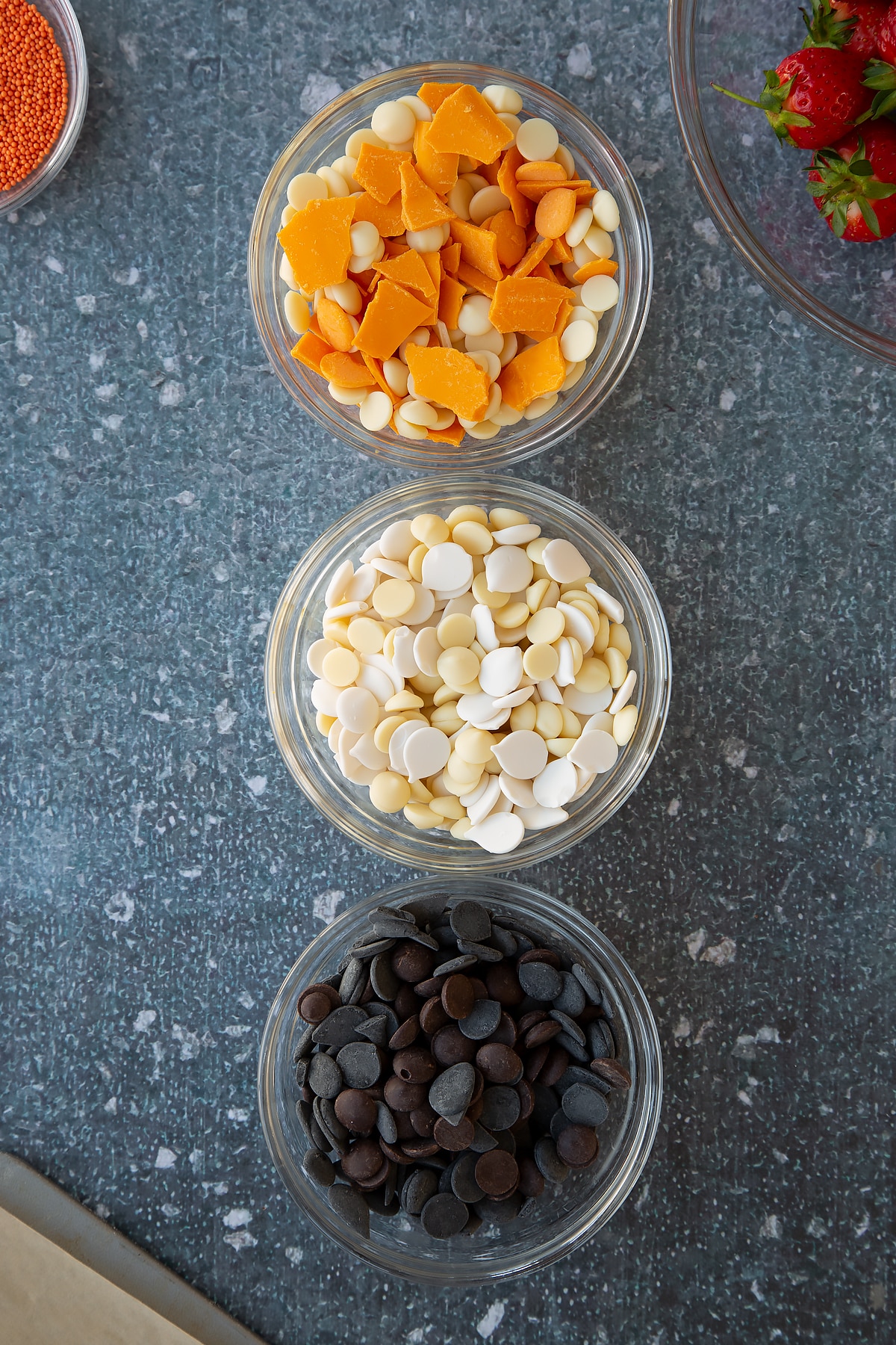 Overhead shot of three small bowls of chocolates.