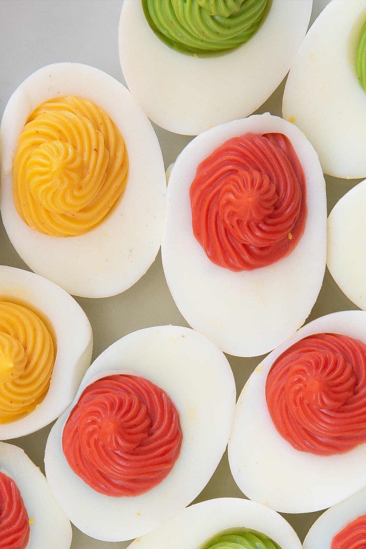 The eggs having been reassmbled with the egg mixture using a piping bag.