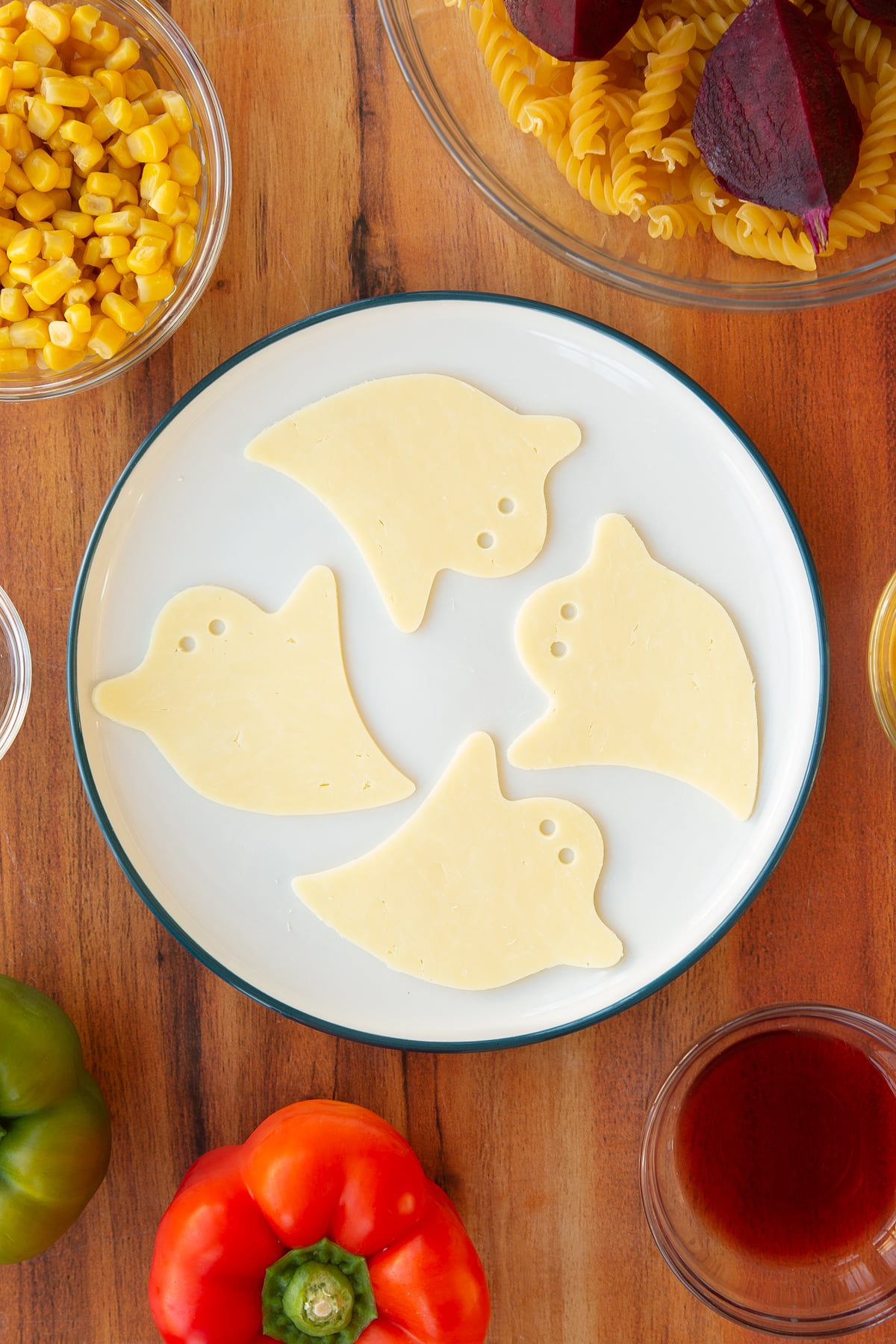 Finished slices of cheese in the form of a ghost.