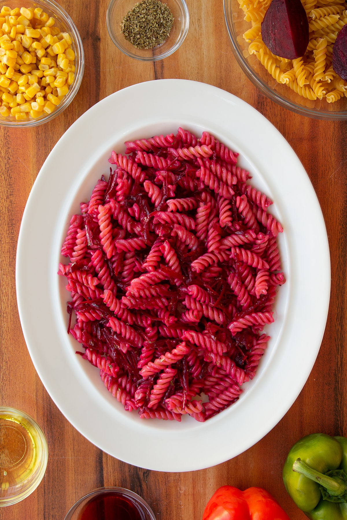 The finished beatroot pasta salad in a white bowl.
