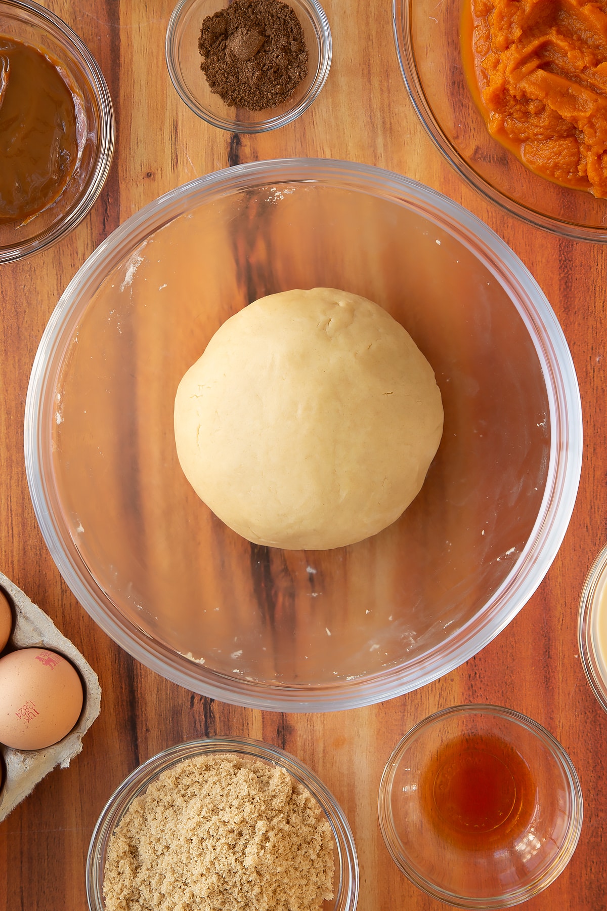 The caramel pumpkin pie pastry having been mixed and kneaded into a ball.