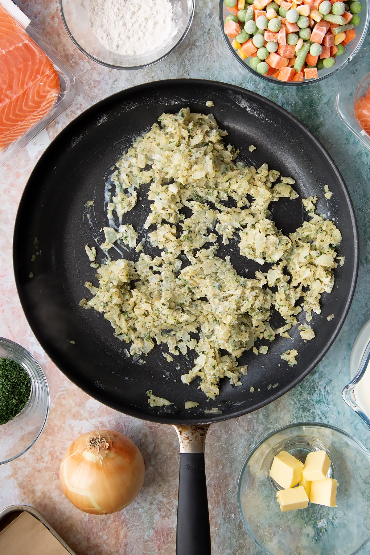 Stiring the onion mixture in the pan.